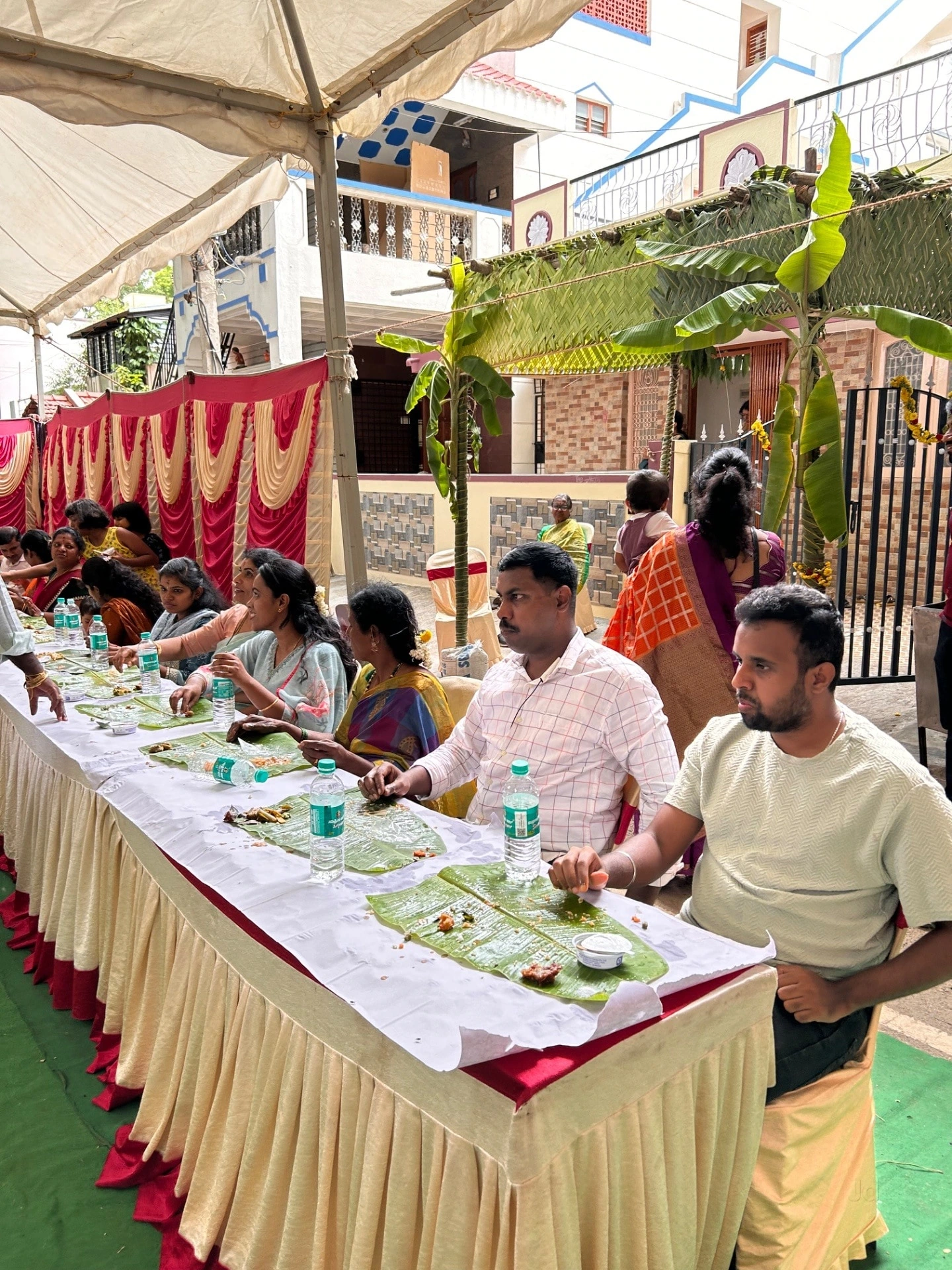 A family gathering with traditional banana leaf dining