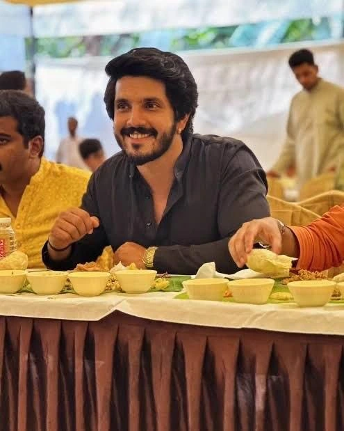 A guest seated for a traditional banana-leaf meal