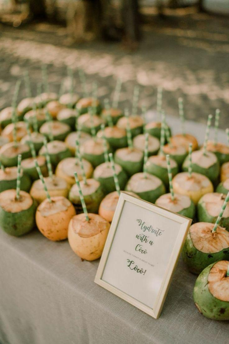 Tender coconuts arranged for guests with paper straws