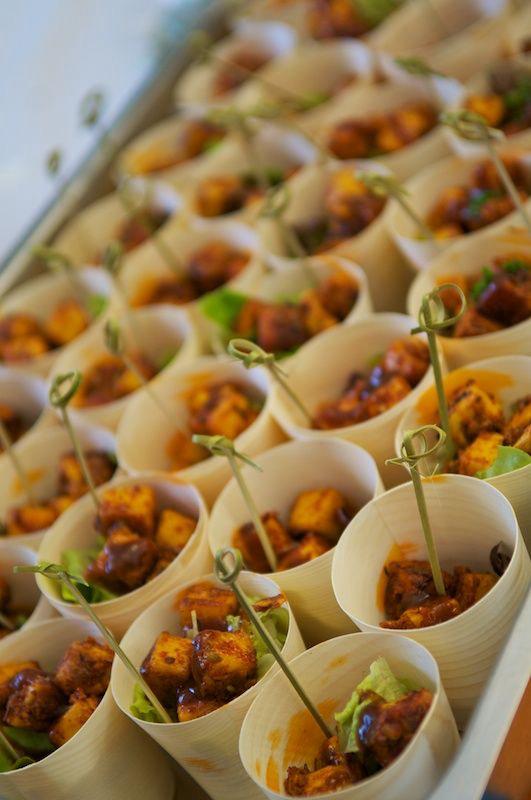Paneer bites presented in individual wooden bowls