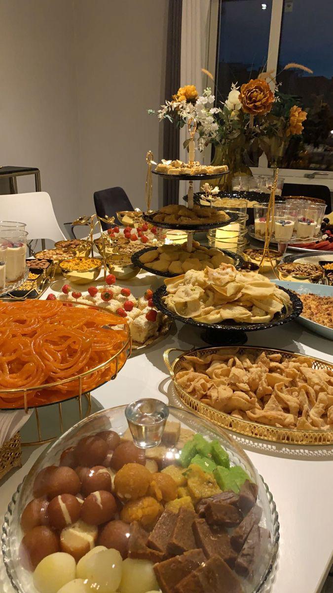 Indian sweets and savoury snacks presented on tiered stands